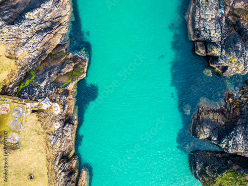 Aerial drone view of Port of Stoth on the Isle of Lewis. Turquoise sea water.