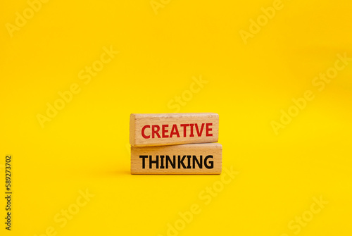 Creative thinkig symbol. Wooden blocks with words Creative thinkig. Beautiful yellow background. Business and Creative thinkig concept. Copy space. photo