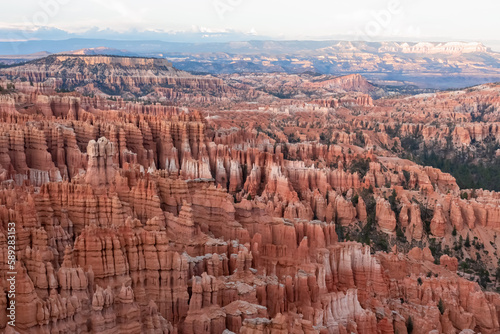 Aerial sunset view of massive hoodoo sandstone rock formation boat mesa in Bryce Canyon National Park, Utah, USA. Last sun rays touching on natural unique amphitheatre sculpted from red rock. Twilight © Chris