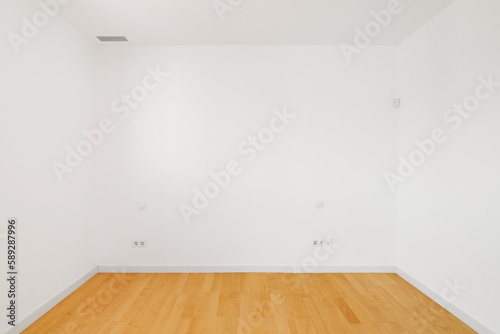 Compact bright room with white walls with ventilation and sockets. The concept of preparing for the move and furnishing or hostel rooms. Copyspace