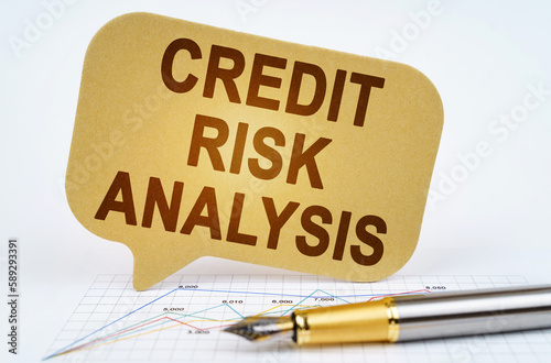 On the business diagram is a pen and a sign with the inscription - Credit Risk Analysis photo