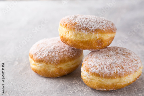 donuts berliners with filling sprinkled with powdered sugar