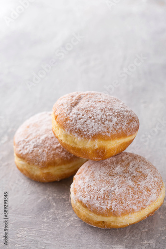 donuts with filling sprinkled with powdered sugar