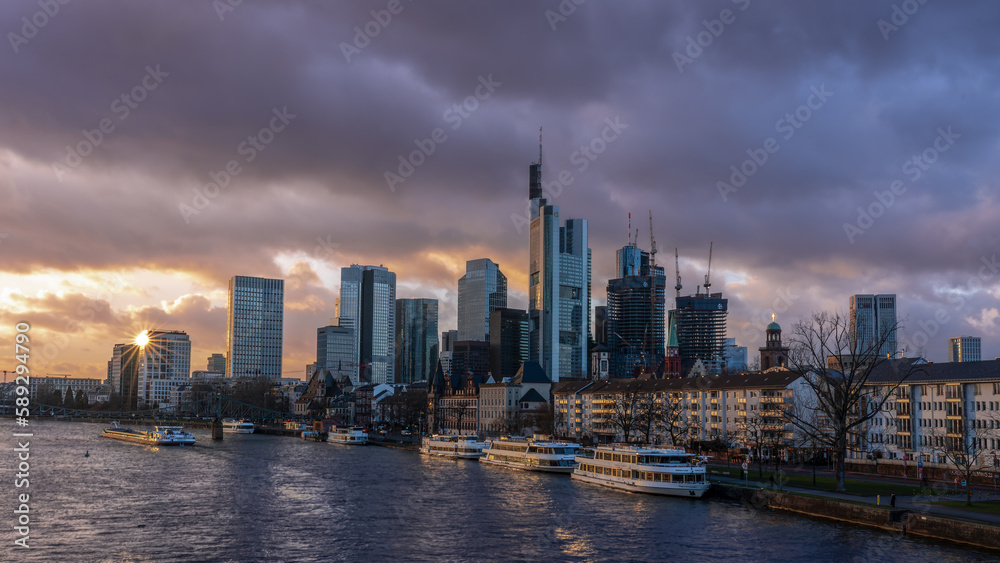 Frankfurt am Main, Germany, a sun star in the city skyline in the evening hours