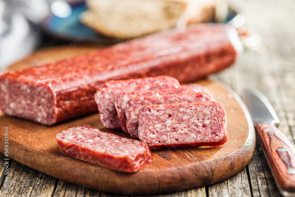 Smoked .sausage. Sliced salami on cutting board. Smoked .sausage. Sliced salami on cutting board.