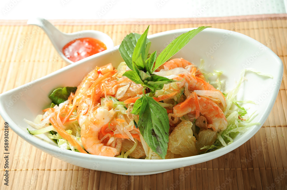 Yuzu Shrimp Salad with chilli sauce served in dish isolated on table green food Yuzu Shrimp Salad with chilli sauce served in dish isolated on table green food
