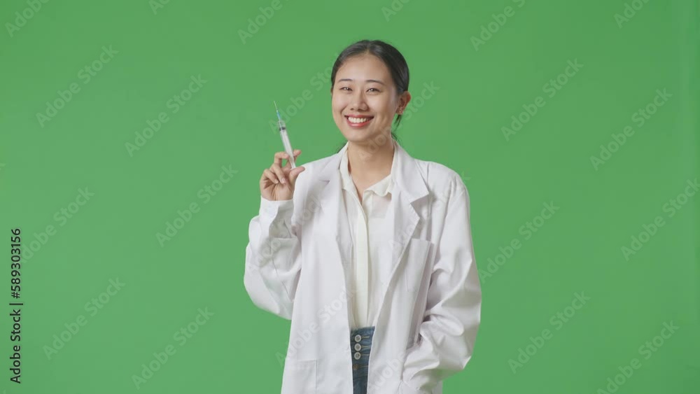Asian Woman Doctor Holding A Syringe And Smiling On Green Screen Background In The Hospital
Asian Woman Doctor Holding A Syringe And Smiling On Green Screen Background In The Hospital