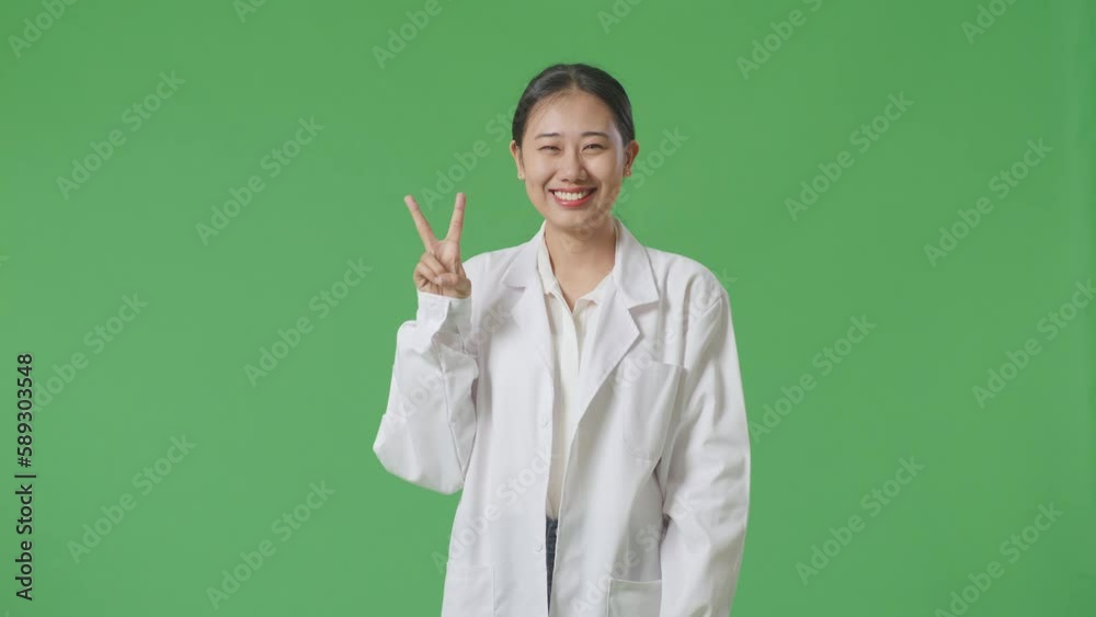 Asian Woman Doctor Showing Gesture Peace And Smiling On Green Screen Background In The Hospital
Asian Woman Doctor Showing Gesture Peace And Smiling On Green Screen Background In The Hospital
