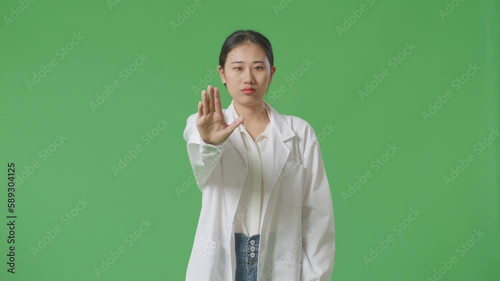 Asian Woman Doctor Making Stop Gesture While Standing On Green Screen Background In The Hospital
Asian Woman Doctor Making Stop Gesture While Standing On Green Screen Background In The Hospital
