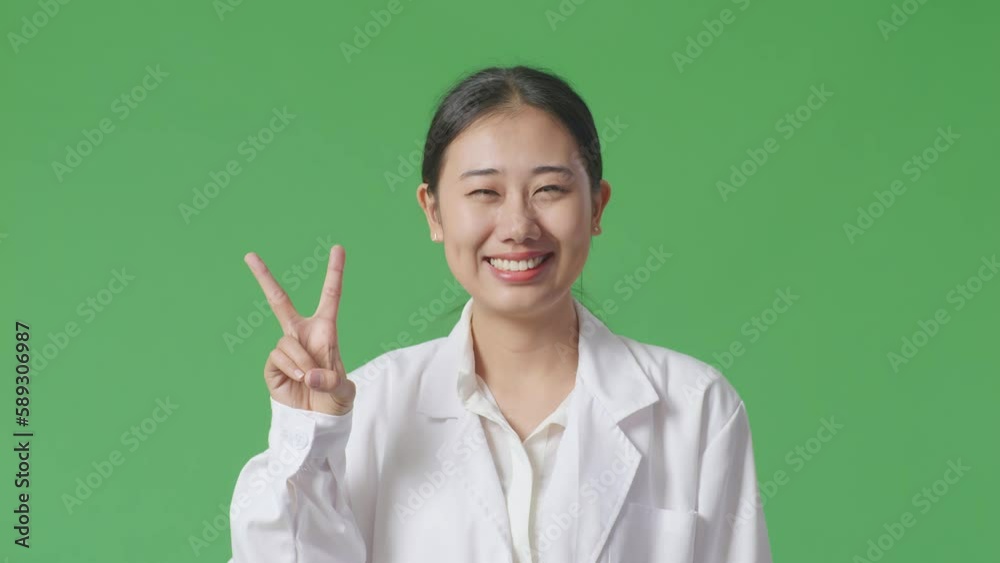 Close Up Of Asian Woman Doctor Showing Gesture Hands Palm, Saying Wow, And Smiling On Green Screen Background In The Hospital
Close Up Of Asian Woman Doctor Showing Gesture Hands Palm, Saying Wow, And Smiling On Green Screen Background In The Hospital