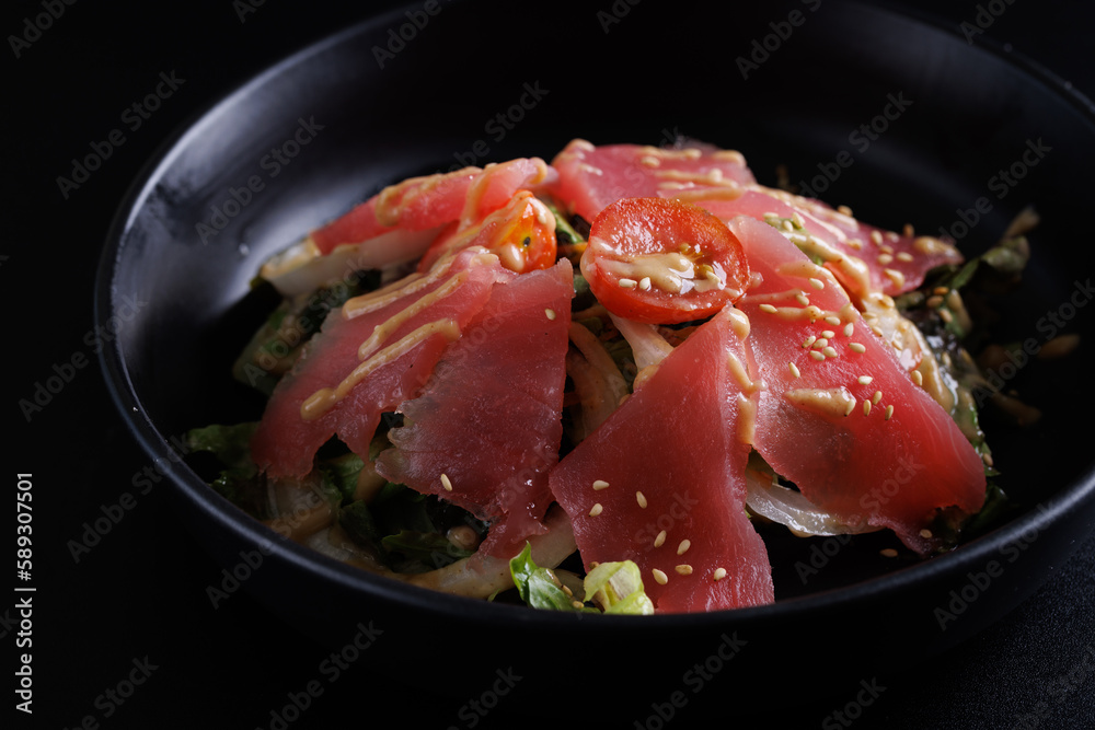 Japanese salad isolated in black background Japanese salad isolated in black background