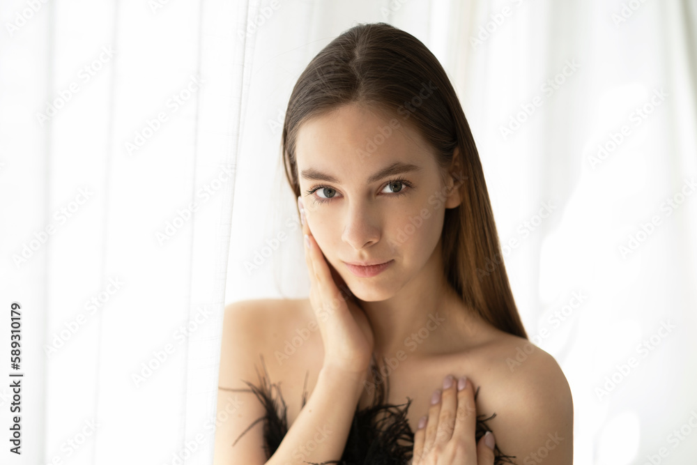 Beauty young woman with perfect face on window curtains background. Beauty young woman with perfect face on window curtains background.