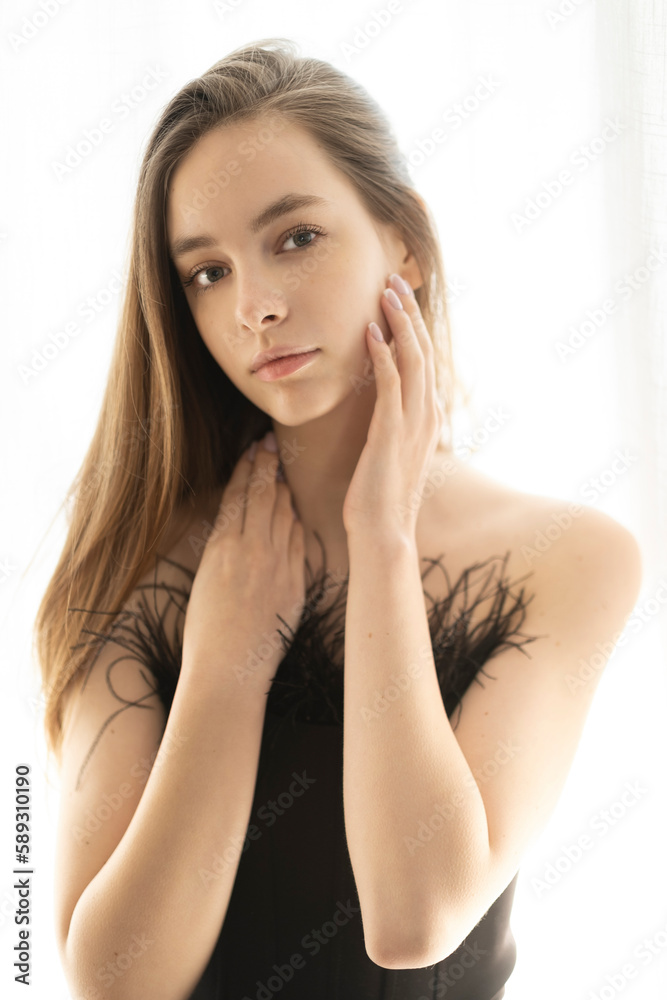 Beauty young woman with perfect face on window curtains background. Beauty young woman with perfect face on window curtains background.