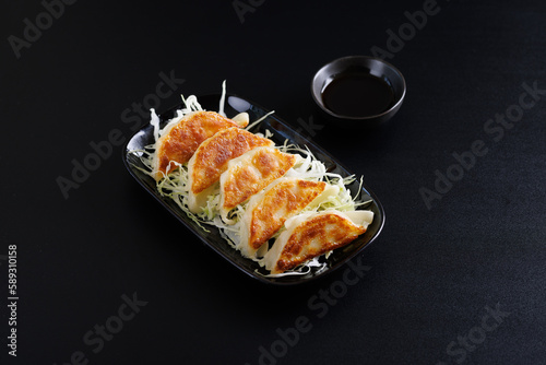 Gyoza Japanese food dumpling isolated in black background