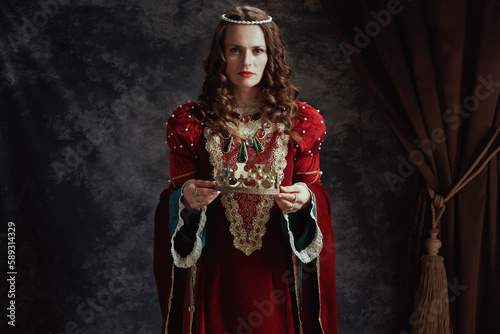 medieval queen in red dress with crown