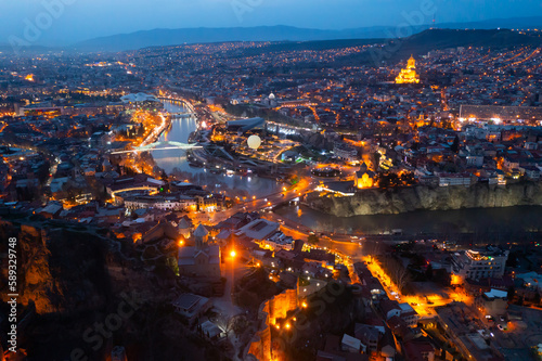 Night aerial view of Tbilisi city with Kura river and Europe square in the spring, Georgia © JackF