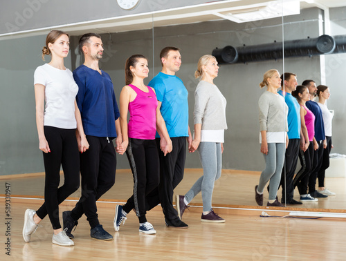 Celtic dance class for adults, positive people training during group class in fitness center