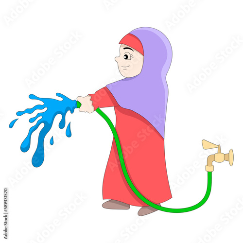 Islamic woman is watering the plants using a hose