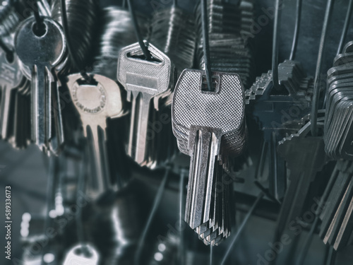 Many key chains for copy key on locksmith shop.