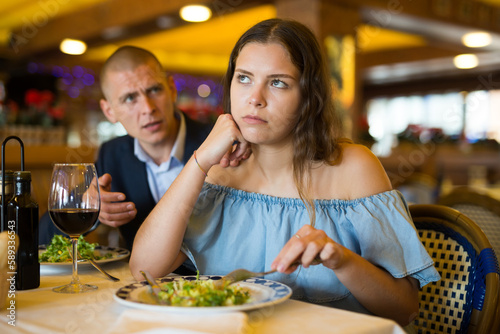 Portrait of couple having problems in relations  arguing in restaurant