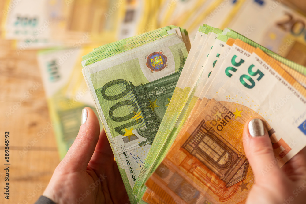 euro banknotes.Money counting. Recalculation of money.Counting euro banknotes.Hands recalculate banknotes.Expenses in European countries.pack of money in a hand close -up.