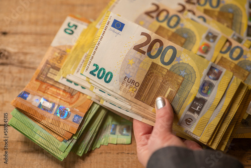 200 euro banknotes. Recalculation of money. Hands recalculate banknotes.Expenses and incomes in European countries.pack of money in a hand close -up.
