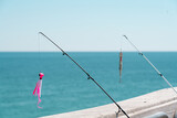 Fishing poles off the pier