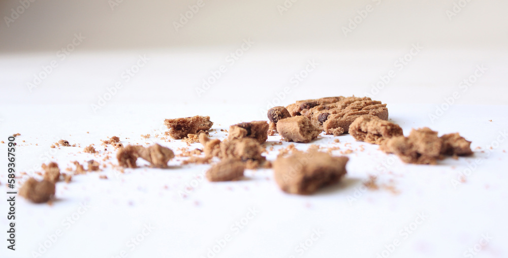 Chocolate chip cookies with crumbs isolated on white background Chocolate chip cookies with crumbs isolated on white background