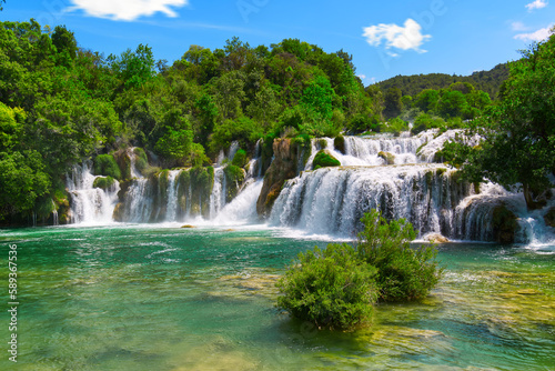 Beautiful Waterfall background in sunny summer day. Beautiful Waterfall In Krka National Park - Croatia  Europe. Krka river waterfalls in the Krka National Park
