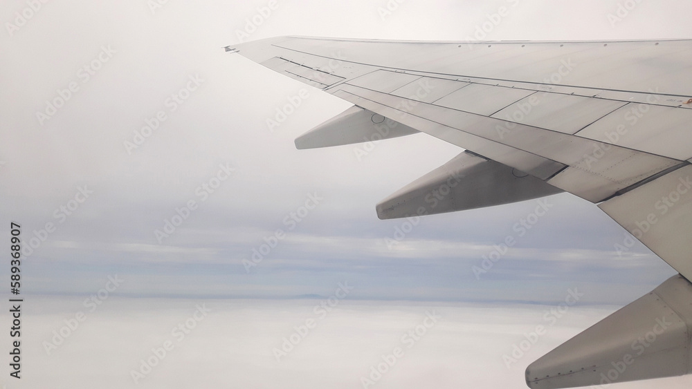 Airplane wings flying in the sky. Airplane wings flying in the sky.