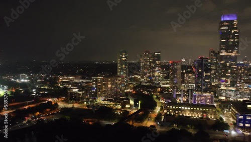 Downtown Austin, Texas skyline at night with drone video panning left to right. photo