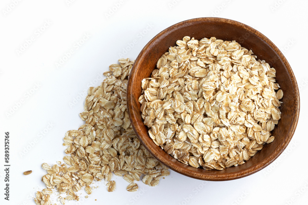 Dry rolled oatmeal in bowl isolated on white background. Dry rolled oatmeal in bowl isolated on white background.