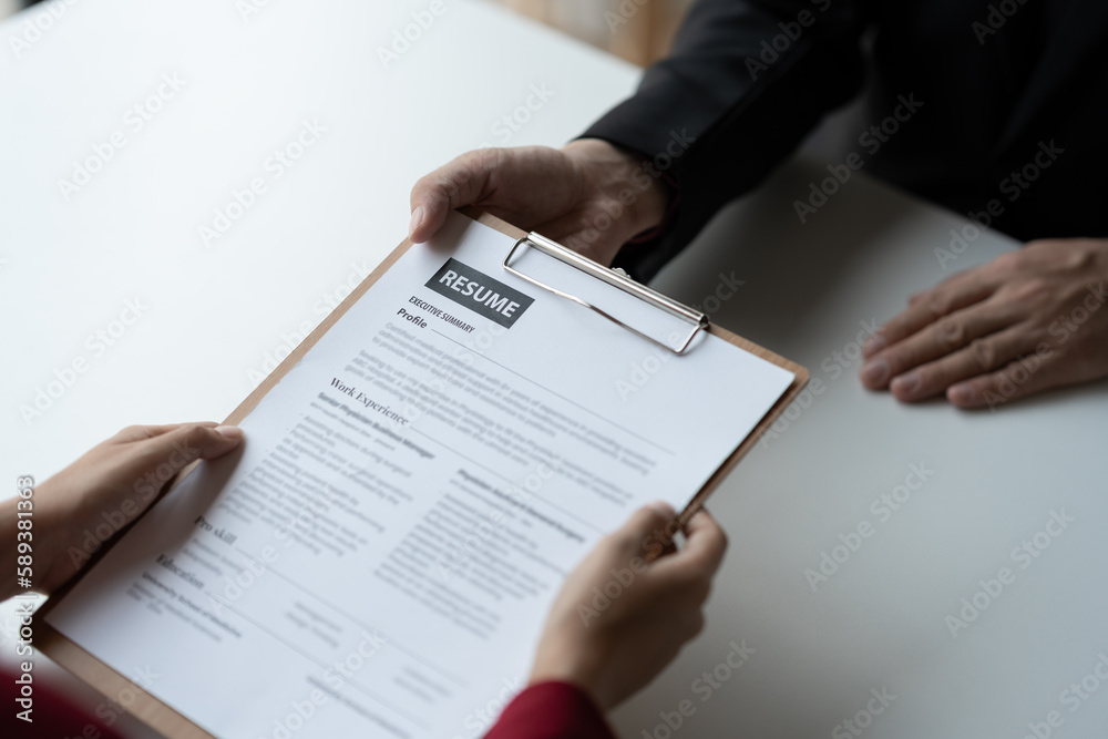 Human resources staff explaining the details of the resume filling out on the chart to the person applying for a job interview with the company. employee job application concept. Human resources staff explaining the details of the resume filling out on the chart to the person applying for a job interview with the company. employee job application concept.
