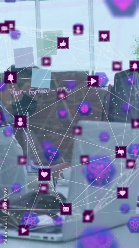 Animation of network of connections with icons over african american man with face mask using laptop Animation of network of connections with icons over african american man with face mask using laptop