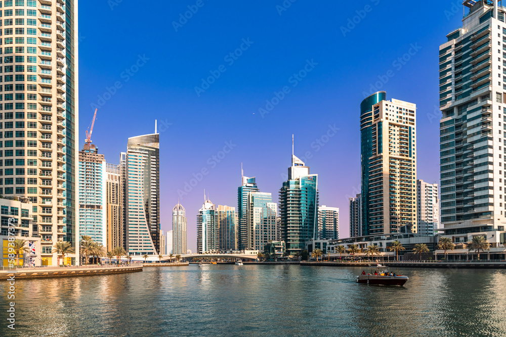 Twilight at the Dubai Marina, a waterfront promenade of shops, boat marinas and skyscrapers, along the coast of Dubai, United Arab Emirates.	