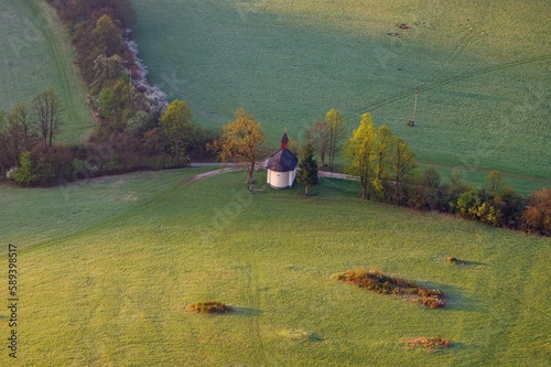 Spring green and colour country with a chapel under the. Podskalsky Rohac hill in Strazov Mountains Protected Landscape Area, Slovakia, Europe. photo