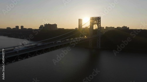 Silhouette George Washington bridge, sunny evening in NY - Ascending aerial view photo