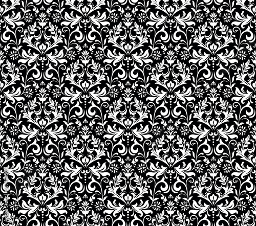 Wallpaper in the style of Baroque. Seamless vector background. White and black floral ornament. Graphic pattern for fabric, wallpaper, packaging. Ornate Damask flower ornament