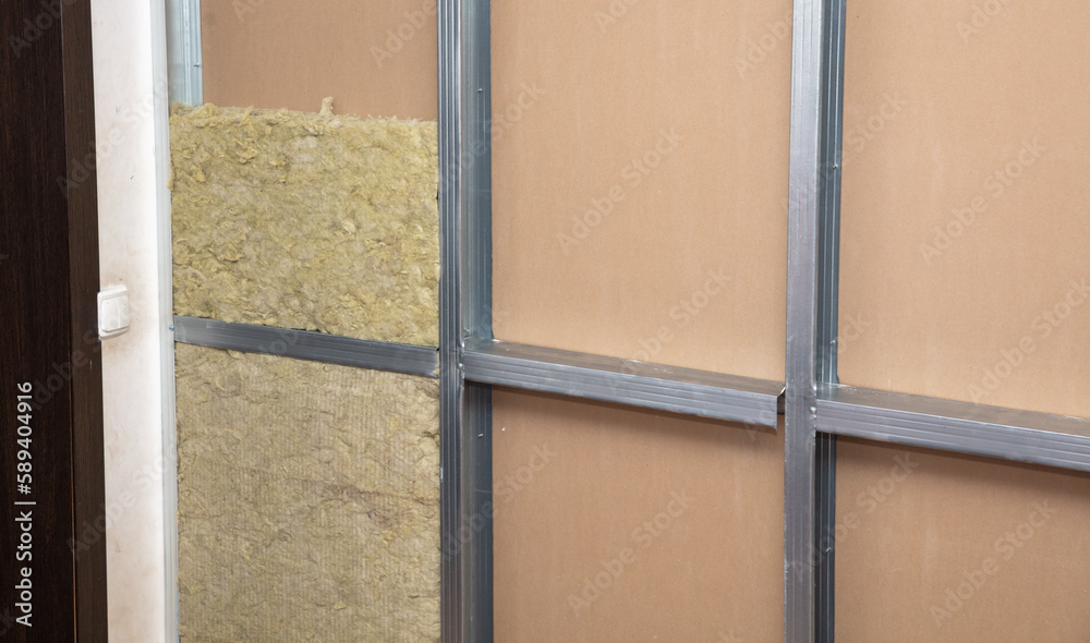 Fototapeta premium Insulation and glass wool in the wall of the room