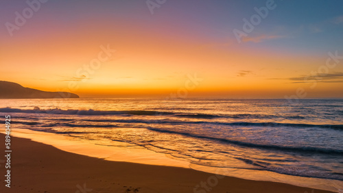 Soft hazy sunrise seascape © Merrillie