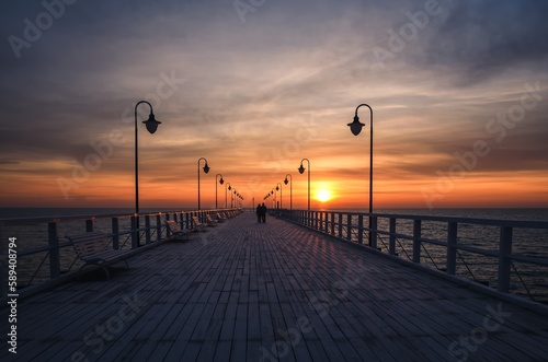 Beautiful sunrise over the Polish sea. Popular pier on the Baltic Sea at sunrise. Photo taken in Gdynia, Poland.