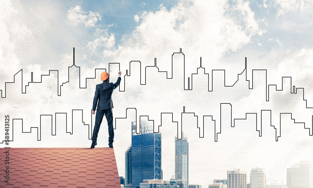 Man architect draw silhouette of modern city on blue sky. Mixed Man architect draw silhouette of modern city on blue sky. Mixed