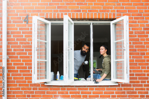 Couple looking through window