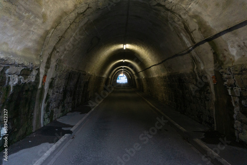 Dark and scary tunnel with a light at the end