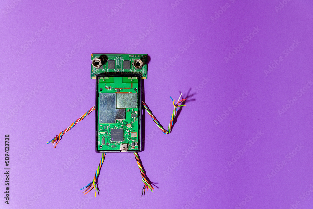 Hand made robot flat lay on the arduino platform. DIY. AI. STEAM.purple background.Stem education for children and teenagers, robotics and electronics.Copy space.
