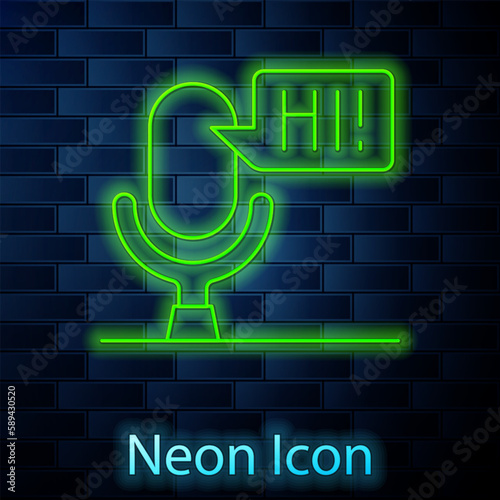 Glowing neon line Microphone voice device icon isolated on brick wall background. Microphone interpreter and alphabet letters. Vector