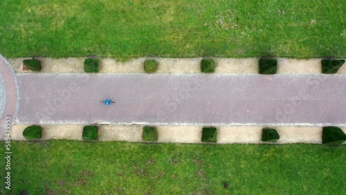 Aerial top down shot of cyclist in city park, Scotland photo