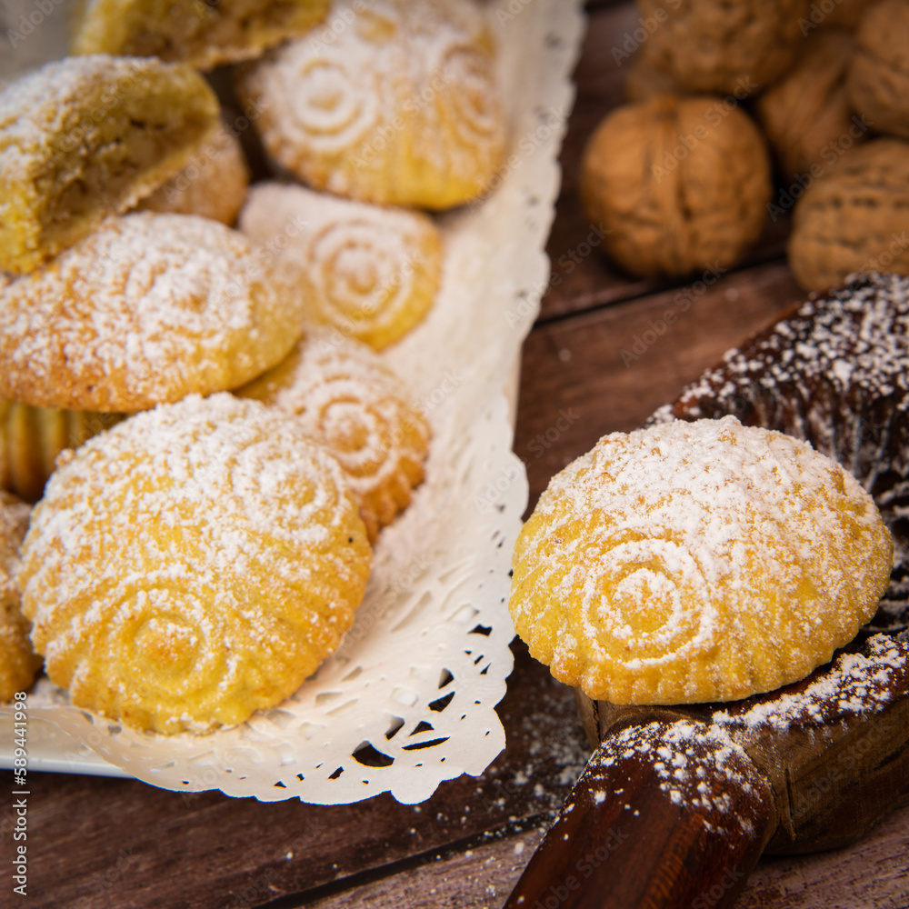Traditional eid maamoul or mamoul cookies with dates, nuts, and jam, Arabic sweets for Aid al-Fitr and easter, High quality photo
