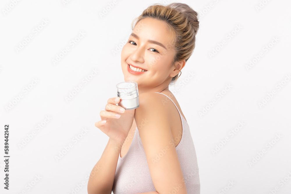 Happy beautiful young asian woman holding cosmetic cream blank bottle, Fashion model, Health wellness, Beautiful girl skin care and facial treatment. Isolated on white background. Happy beautiful young asian woman holding cosmetic cream blank bottle, Fashion model, Health wellness, Beautiful girl skin care and facial treatment. Isolated on white background.