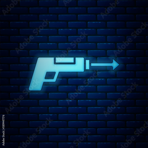 Glowing neon Fishing harpoon icon isolated on brick wall background. Fishery manufacturers for catching fish under water. Diving underwater equipment. Vector